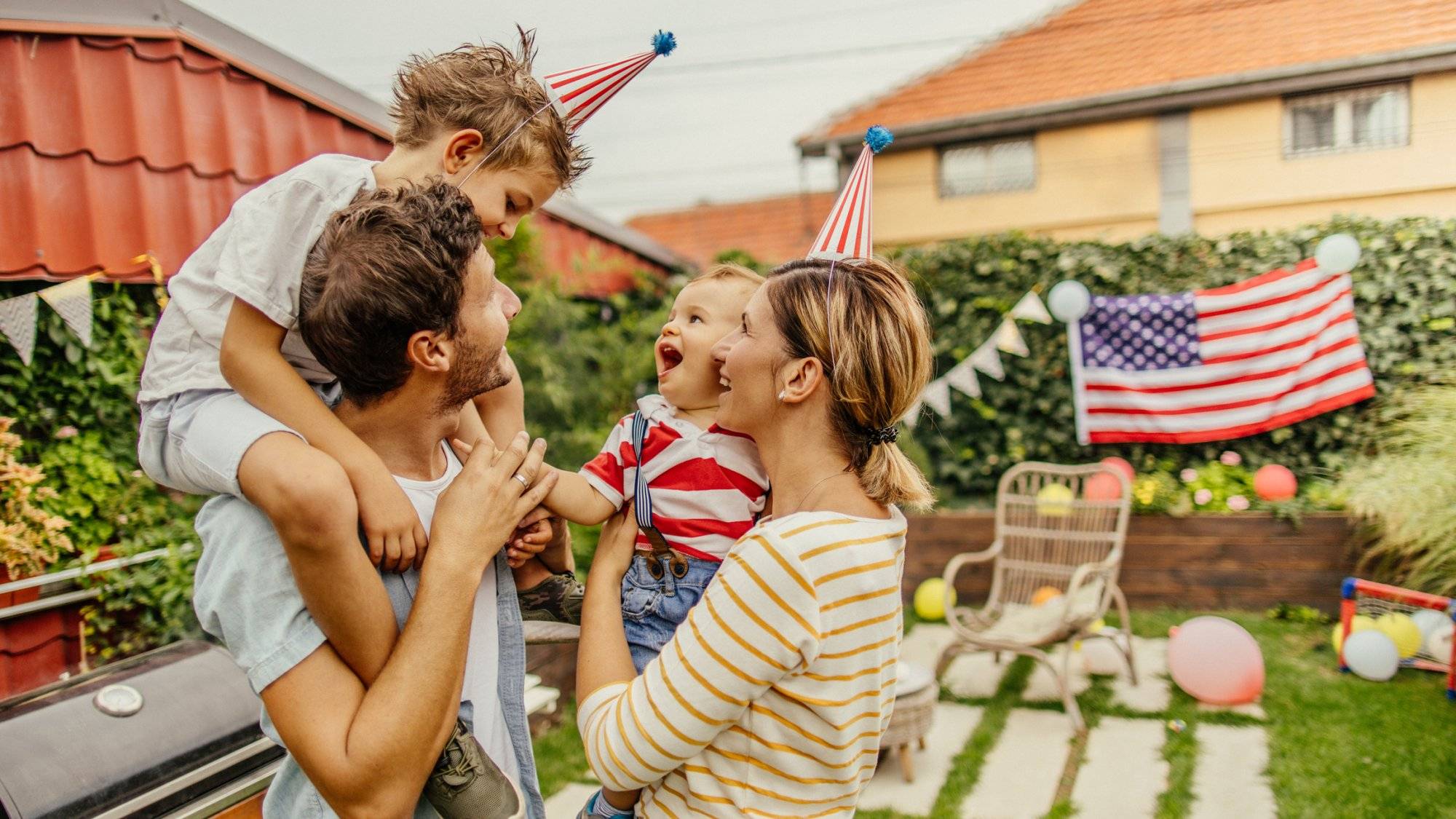 Happy family celebrating Fourth of July Happy family celebrating Fourth of July