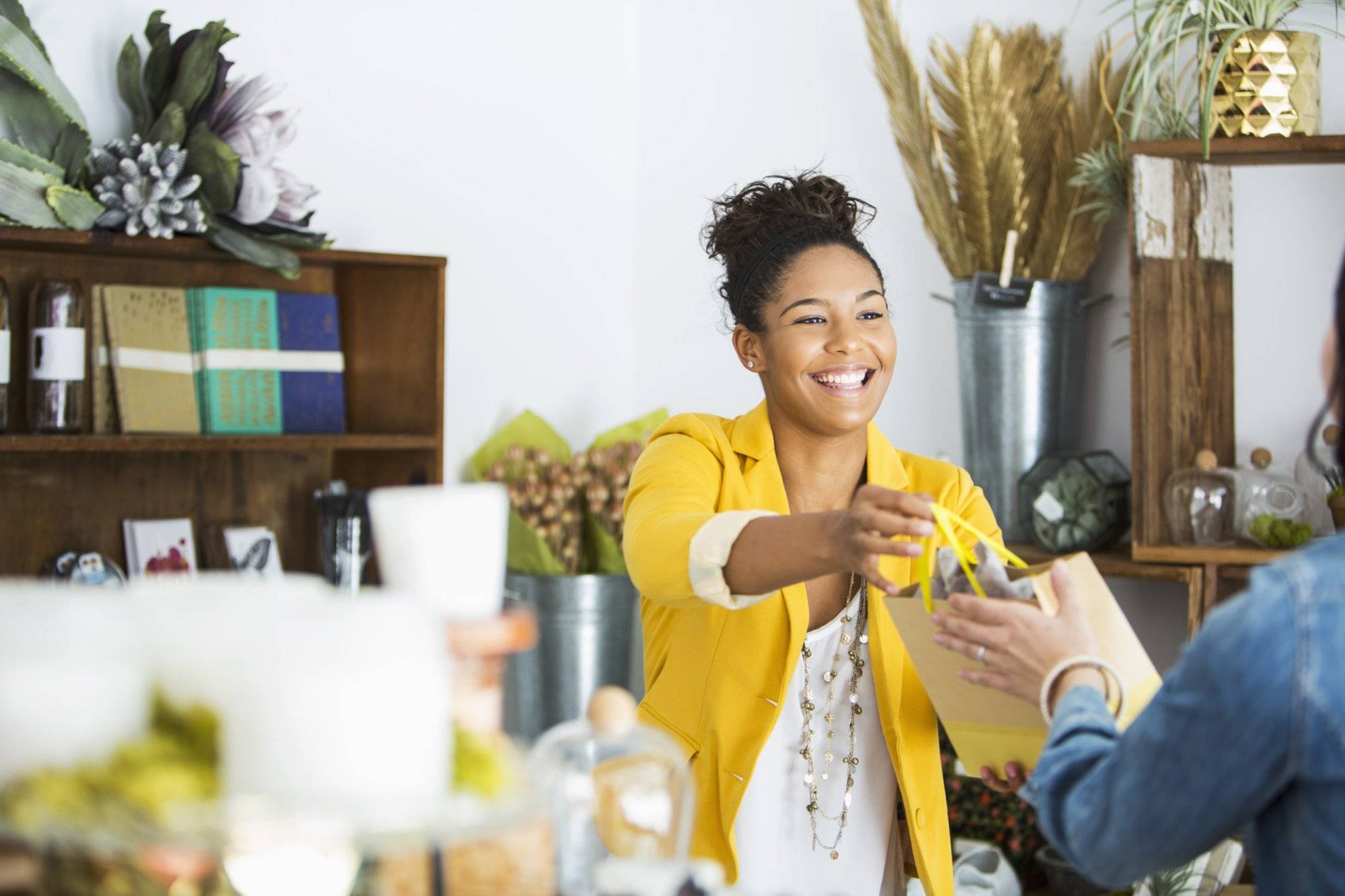 Saleswoman helping customer Saleswoman helping customer