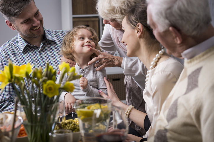 Three-generation family enjoying dinner