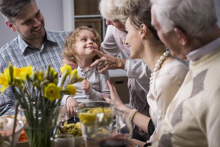 Three-generation family enjoying dinner Three-generation family enjoying dinner